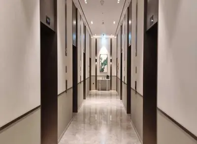 a hallway of a building with black and white walls at Grande-5703,2 BHK Down Town, Dubai in Dubai