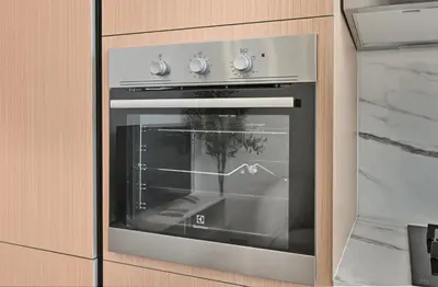 an oven in a kitchen with its door open at Aura by Grovy Studio - Parking, Sauna&Gym, Pool - by Rentujemy in Dubai