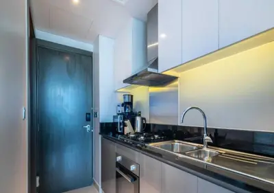 a kitchen with a sink and a stove at Premium Living with Canal views and Top Notch Amenities in Dubai