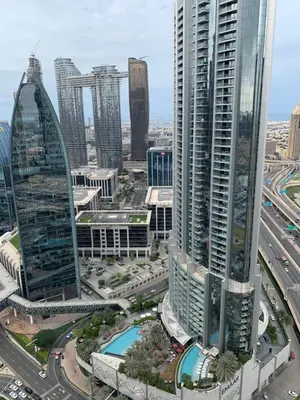 an aerial view of a city with tall buildings at Kempinski Central Avenue Residence Largest 1BR with Burj Khalifa View in Dubai