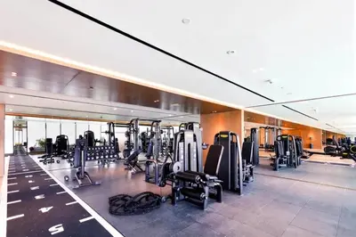 a gym with treadmills and cardio equipment in a building at Luxury Studio - Private Jacuzzi & Burj Khalifa View in Dubai