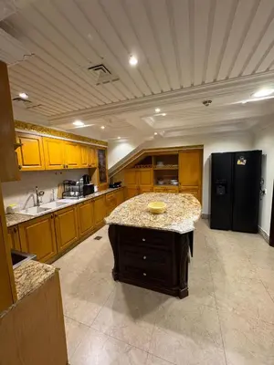 a large kitchen with a island in the middle at Smile Home Marina JBR Bed space in Dubai