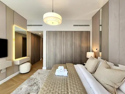 a living room with a couch and a television at SOLARTE Luxe - LIV Marina - Premium 2BR Residence in Dubai