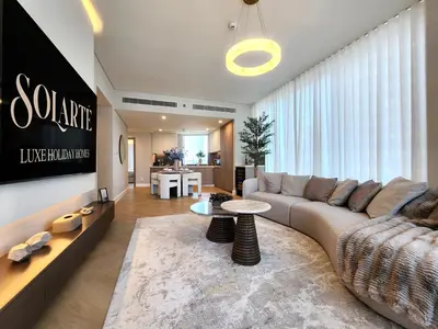 a living room with a couch and a table at SOLARTE Luxe - LIV Marina - Premium 2BR Residence in Dubai