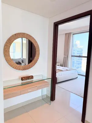 a bedroom with a mirror and a bed at Dubai Mall connected, 38th floor, Amazing pool in Dubai