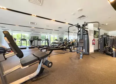 a gym with several treadmills and cardio machines at Dubai Mall connected, 38th floor, Amazing pool in Dubai