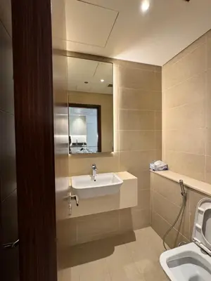 a bathroom with a sink and a mirror at Free Infiniti Pool and Jacuzzi - Marina Gate Luxury Stay - Enjoy Dubai Marina Views in Dubai