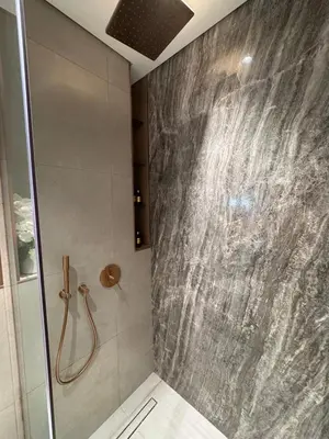 a bathroom with a shower stall and a shower at Dubai corner at Westwood Imtiaz 1BR apartment in Dubai