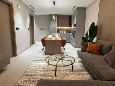 a living room with a table and a couch at Dubai corner at Westwood Imtiaz 1BR apartment in Dubai