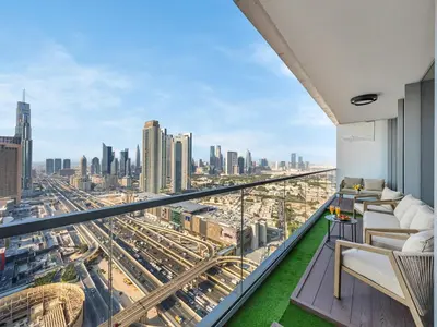 a room with a view of a city at 2 Bedroom Luxury Burj Khalifa & Fountain View Connected to Dubai Mall in Dubai