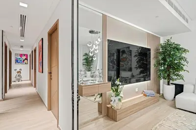 a hallway of a house with a living room at Creek Escape - Palace Residences - Creek Harbour in Dubai
