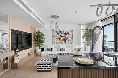 a living room with a couch and a table at Creek Escape - Palace Residences - Creek Harbour in Dubai