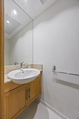 a bathroom with a sink and a mirror at SanctuaryStays - A Luxury apartment with Full Burj Khalifa and Dubai Fountain Views - Dubai Mall Access in Dubai