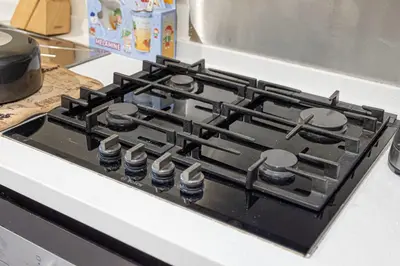 a stove top oven sitting on top of a counter at High Floor Balcony Suite 8 mins to Burj Khalifa in Dubai