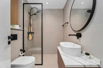 a bathroom with a sink and a toilet and a mirror at Gala Guests - Marina Views Bright Balcony Collection in Dubai