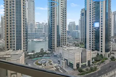 a view of a city skyline with tall buildings at Stylish 3BR JBR l Steps to Beach l Balcony l Sleeps 6 in Dubai
