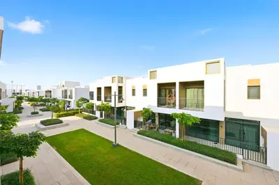 anterior view of an apartment building with a courtyard at Golden Stays - Italian Riviera 4BR Villa I Stylish Bliss Living in Dubai