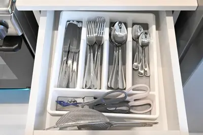 a drawer filled with utensils and silverware at Golden Stays - Italian Riviera 4BR Villa I Stylish Bliss Living in Dubai