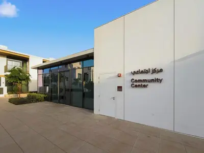 an office building with a sign on the side of it at Golden Stays - Italian Riviera 4BR Villa I Stylish Bliss Living in Dubai