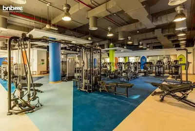a gym with treadmills and exercise equipment at bnbmehomes - Murjan 5 in Dubai
