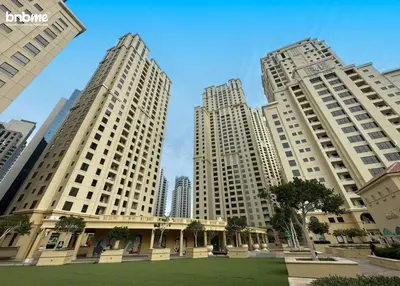 three tall buildings in a city with a park at bnbmehomes - Murjan 5 in Dubai