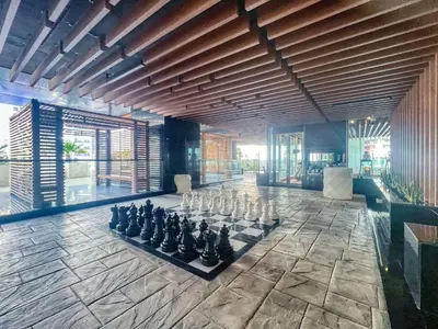 a large room with a chess board on the floor at GuestReady - Burj Khalifa View l Rooftop Pool in Dubai