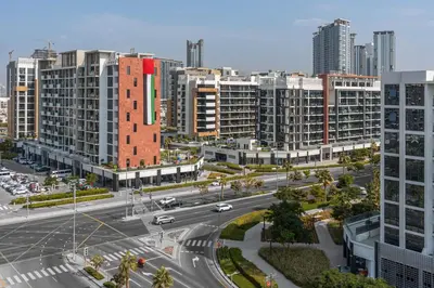 an aerial view of a city with tall buildings at StayShort - Studio Apartment at Azizi Riviera with Balcony in Dubai