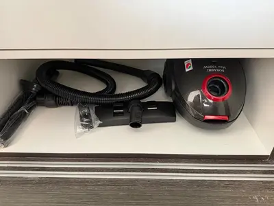 a dvd and a camera sitting in a drawer at Modern studio in the centre of Dubai in Dubai
