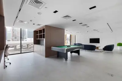 an office with a pool table in the middle of a room at Modern studio in the centre of Dubai in Dubai