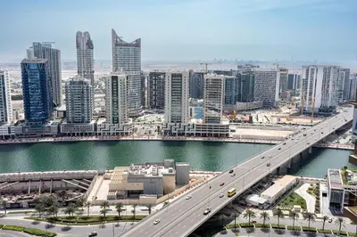 a bridge over a river in a city with buildings at Full burj Khalifa view chic Studio in Dubai
