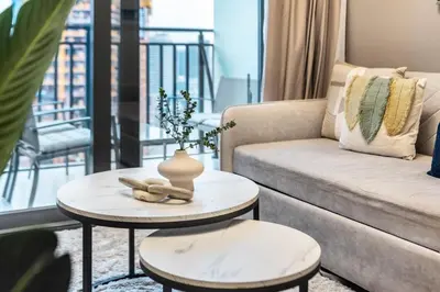 a living room with a couch and a table at GuestReady - 1BR l Canal View in Business Bay in Dubai
