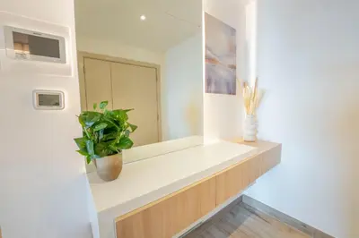a room with a white shelf with a plant on it at EasyGo - Luxury 3BR with Maid's Room, Dubai Eye View, JBR in Dubai