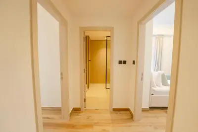 a hallway with a door leading to a bedroom at EasyGo - Luxury 3BR with Maid's Room, Dubai Eye View, JBR in Dubai