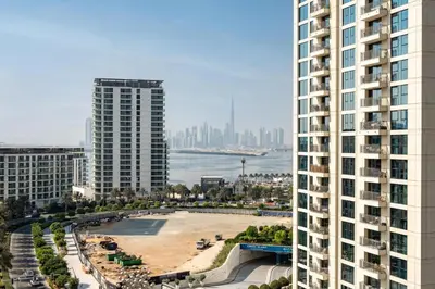 a view of a city with two tall buildings at GuestReady - 1BR | Serene Home in Creek Harbour in Dubai