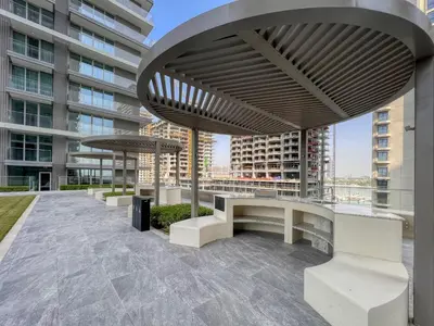 a group of benches on the roof of a building at 1BR at Beach Isle Tower Emaar Beach front by EE Holiday Homes in Dubai