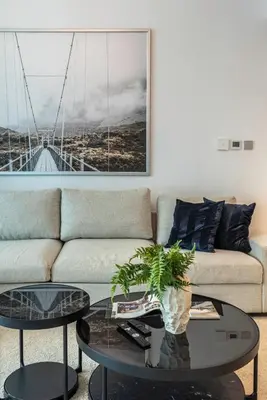 a living room with a couch and a table at 1BR at Beach Isle Tower Emaar Beach front by EE Holiday Homes in Dubai