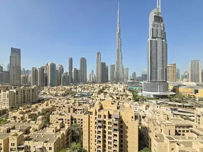 a view of a city with tall buildings at Full Burj Khalifa & Fountain Views - Luxury 2BR in Downtown Dubai in Dubai