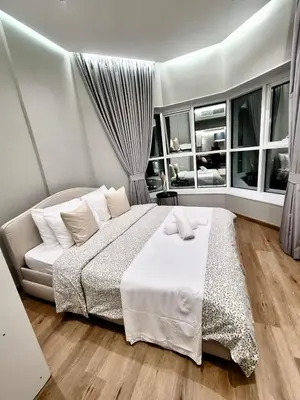 a bedroom with a bed and a large window at ZenStay - Charming Studio in JLT, near JBR &Marina in Dubai