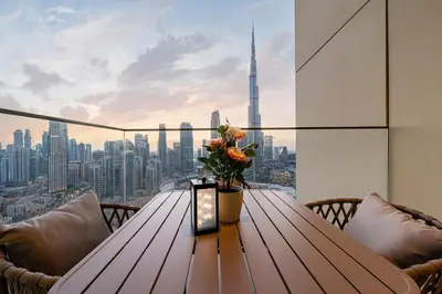 a table with a vase of flowers on top of a building at Burj Royale Luxury 3BR Apartment in Dubai