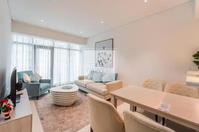 a living room with a couch and a table at Beach Access, Skyline Views, 2 Bedroom and Hall in Dubai