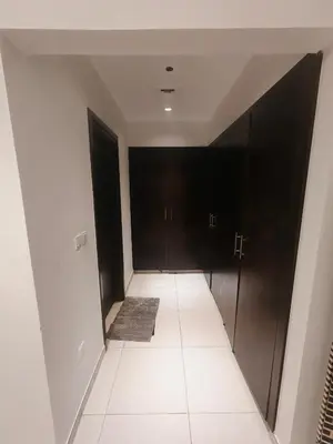 a hallway with black doors and a carpet at Private Room with Bath in Dubai