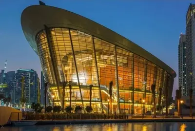 a large building with a portrait of a man on it at Burj Khalifa Area- 2 Chic BR, Act Tower Dubai Mall in Dubai