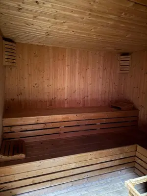 a wooden sauna with a wooden bench in it at Zenstay-Modern 2BR in JLT-Near Marina& Metro in Dubai