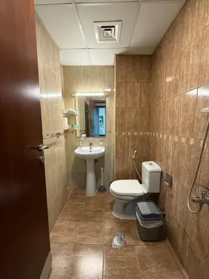 a bathroom with a toilet and a sink at Zenstay-Modern 2BR in JLT-Near Marina& Metro in Dubai