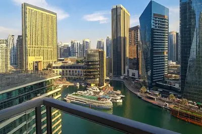 a view of a city with boats in the water at Luxury Marina View 2BR Apartment for 6 in Dubai