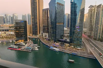 a view of a city with boats in the water at Luxury Marina View 2BR Apartment for 6 in Dubai