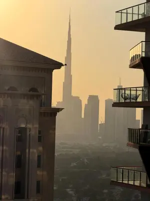 a city skyline with the burj khalifa in the background at Modern 1BR with Pool & Gym, Burj Khalifa View, Al Jaddaf in Dubai