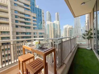 a balcony with a table and chairs on a balcony at Frank Porter - Blvd Central in Dubai
