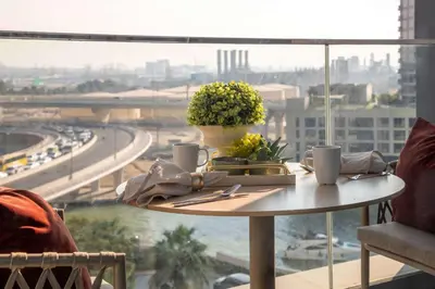 a table in front of a window with a view of a city at Frank Porter - Address Beach Resort Tower in Dubai