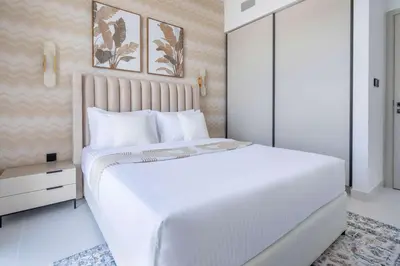 a white bedroom with a large white bed at Frank Porter - Marina Vista Tower 2 in Dubai